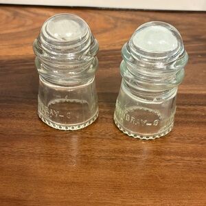 A pair of Vintage Glass Insulators